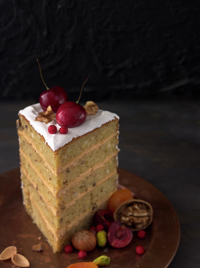 A Slice Of Layer Cake With A Cream Filling Photograph by Janellephoto