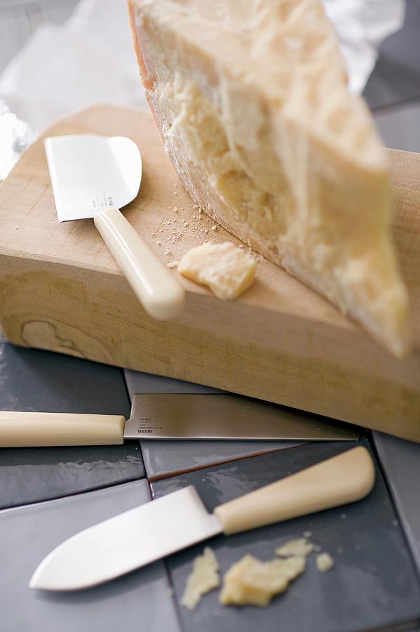 A Slice Of Parmesan And A Cheese Knife Photograph by Frederic Vasseur