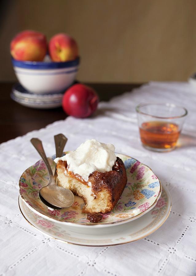 A Slice Of Peach Upside Down Cake With Cream Photograph by Katharine Pollak