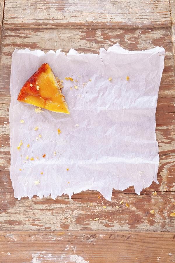 A Slice Of Pear Cake On Grease-proof Paper Photograph by Studio Lipov