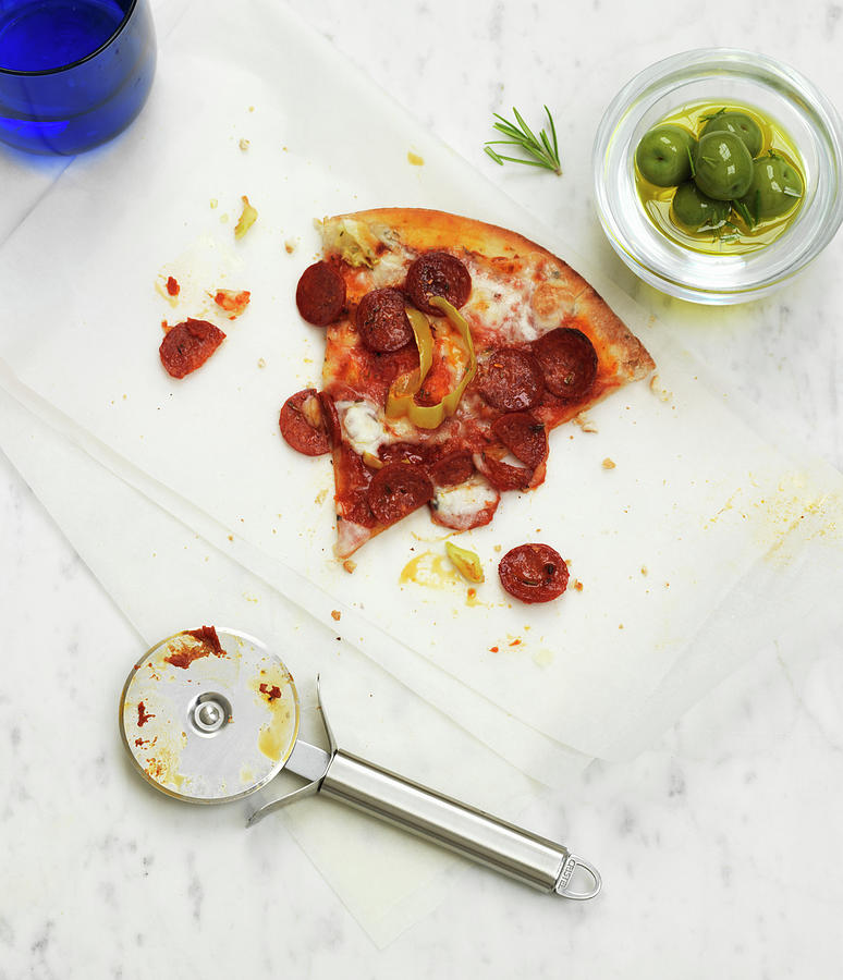 A Slice Of Pepperoni Pizza With A Bowl Of Green Olives Photograph by Hugh Johnson