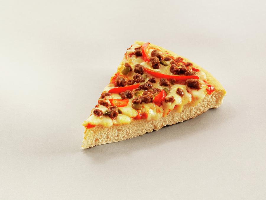 A Slice Of Pizza With Chilli Peppers, Beef And Cheese Photograph by Frank Adam