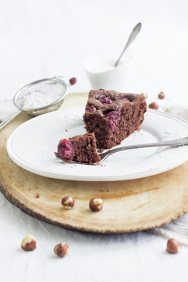 A Slice Of Quick Chocolate Cherry Cake With Hazelnuts Photograph by Tamara Staab