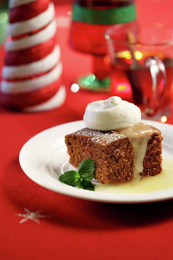 A Slice Of Spiced Cake With Vanilla Sauce And Cream For Christmas Photograph by Perry Jackson