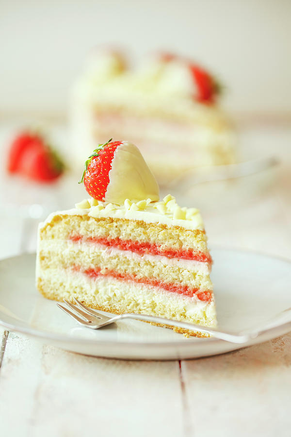 A Slice Of Strawberry And Cream Cheese Cake With Belgian White Chocolate Photograph by Jan Wischnewski