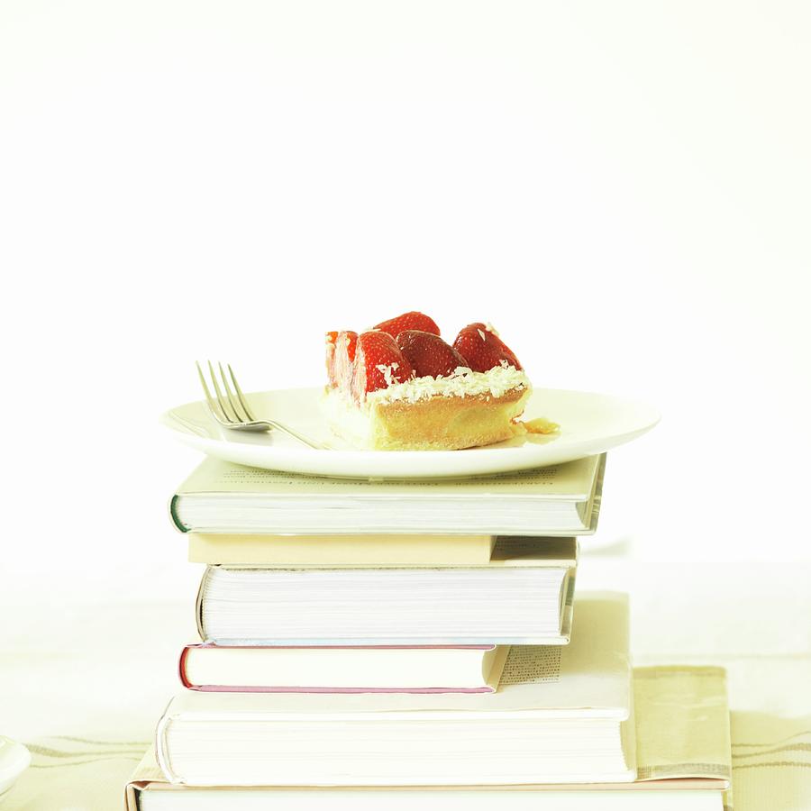 A Slice Of Strawberry Cake On A Stack Of Books Photograph by Schaun, Jeanette