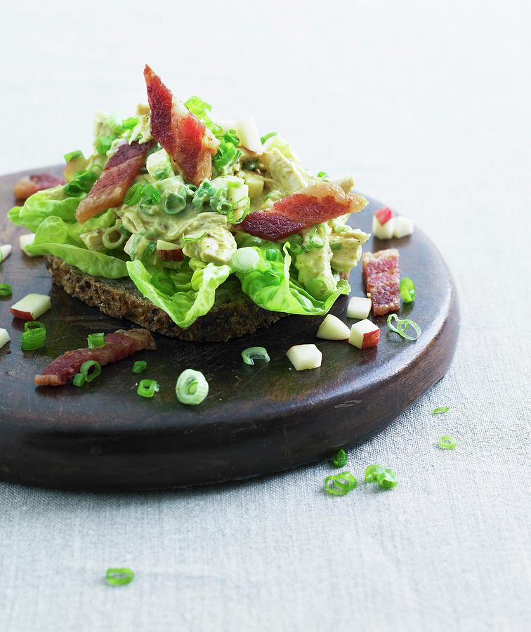 A Slice Of Wholemeal Bread Topped With Salad And Bacon Photograph by Mikkel Adsbl