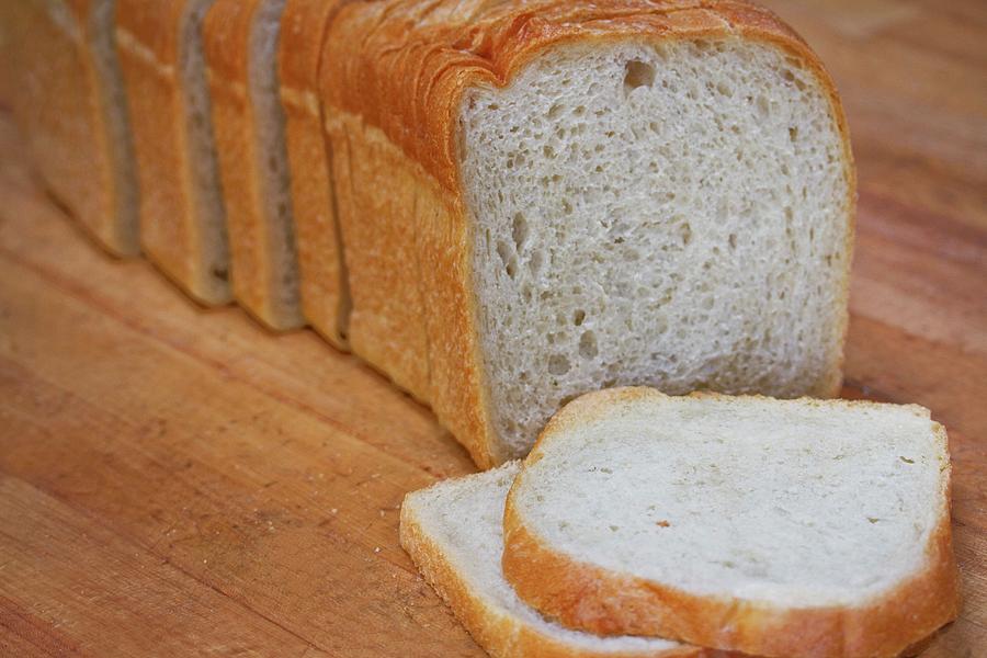 A Sliced Loaf Of White Bread Photograph by Kelsey Skiver