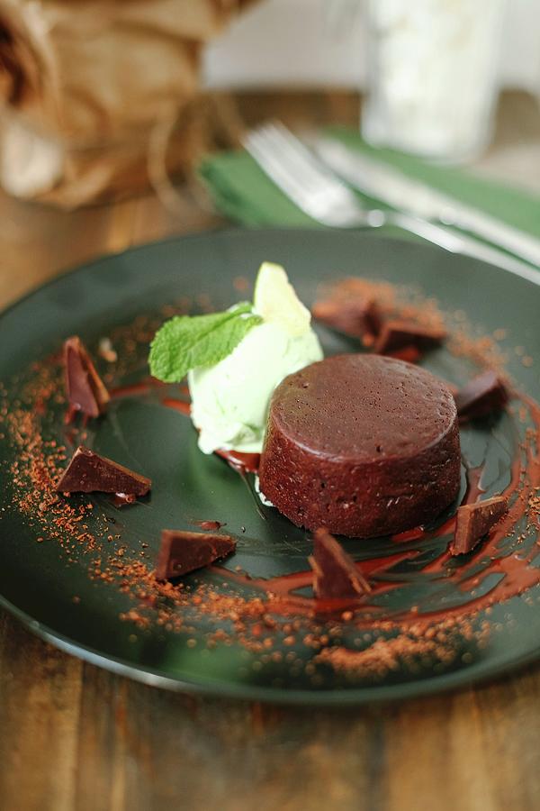 A Small Chocolate Cake With Mint Ice Cream Photograph by Kuzmin5d