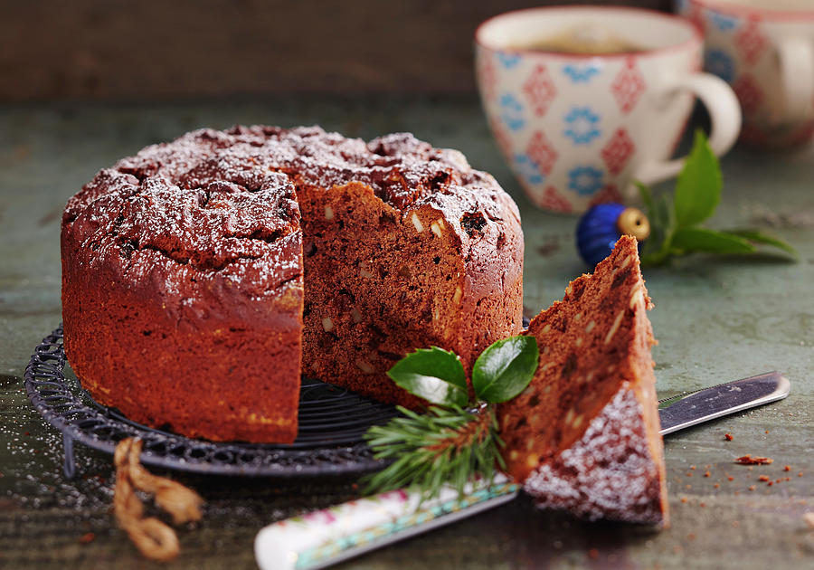 A Small Chocolate Honey Cake With Almonds And Raisins For Christmas Photograph by Teubner Foodfoto