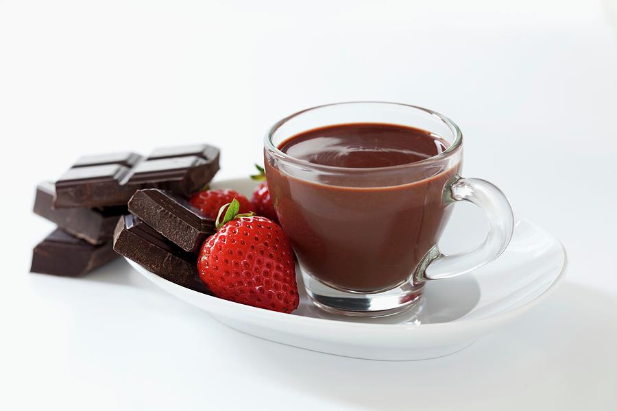 A Small Cup Of Thick Italian Hot Chocolate With Strawberries And Squares Of Dark Chocolate Photograph by Jane Saunders