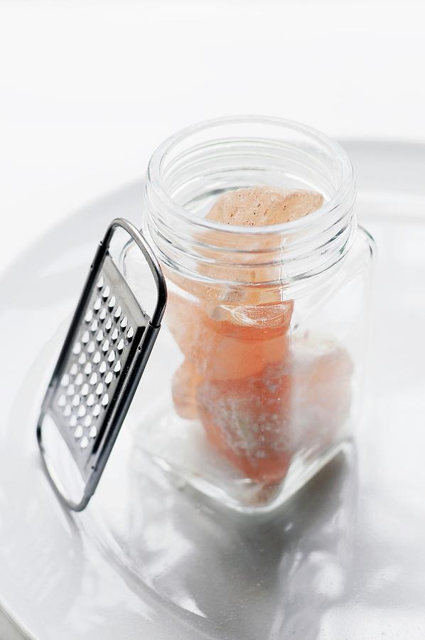 Rose Photograph - A Small Open Jar Of Pink Rock Salt With A Grater by Mueller, Adrian
