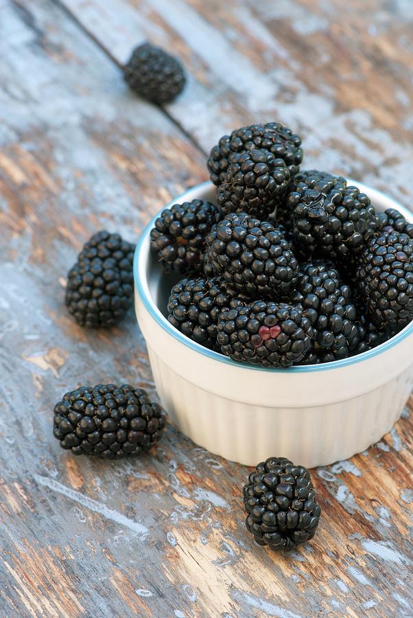 A Small Pot Of Fresh Blackberries Photograph by Spyros Bourboulis