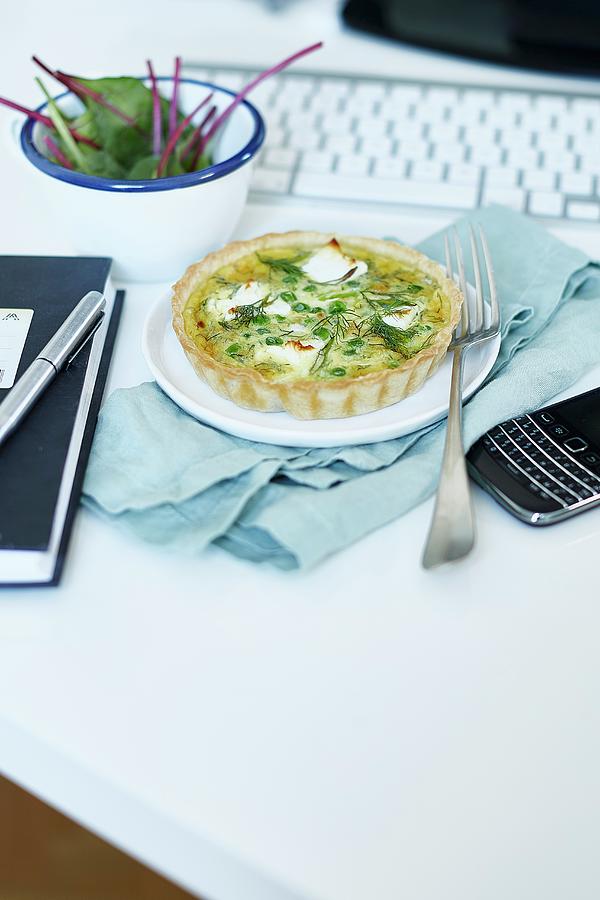 A Small Quiche With Peas And Goats Cheese On A Desk Photograph by The Stepford Husband