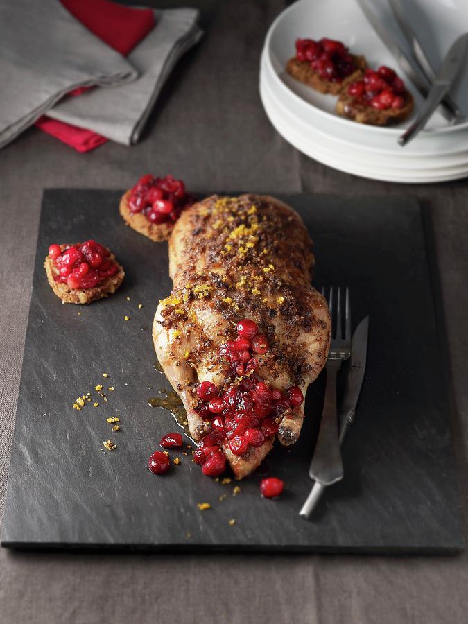 A Small, Stuffed Duck With Cranberries And Oranges Photograph by Atelier Mai 98