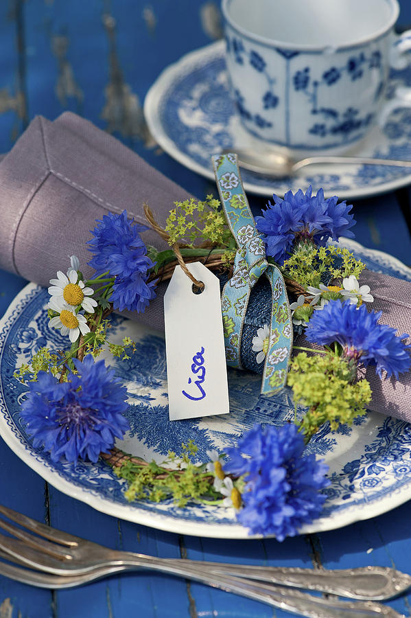 A Small Wreath Of Cornflowers, Ladys Mantle, And Chamomile As A Plate Decoration Photograph by Elisabeth Berkau