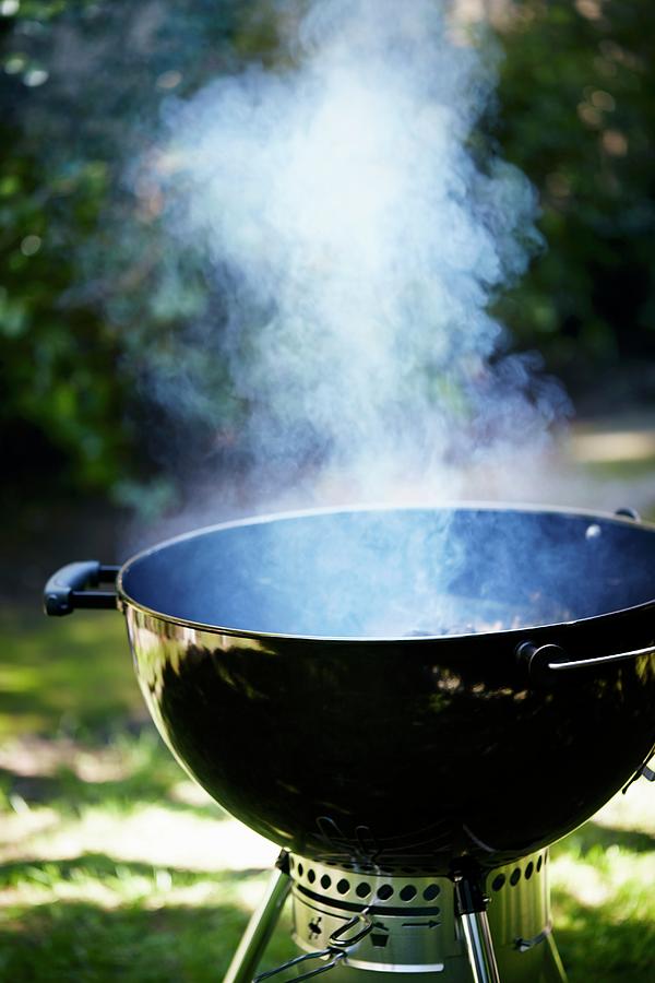 Ascending Photograph - A Smoking Kettle Barbecue by Leigh Beisch