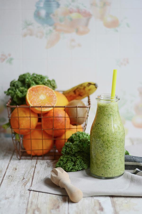A Smoothe Made With Kale, Banana, Orange And Kiwi Photograph by Adriana Baran