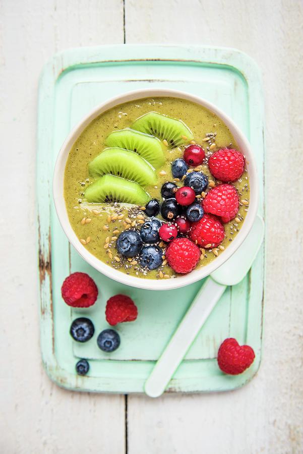 A Smoothie Bowl With Matcha, Kiwi And Berries Photograph by Magdalena Hendey