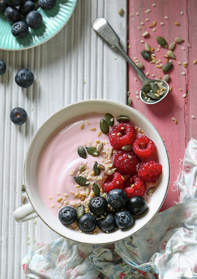 A Smoothie Bowl With Raspberry Yoghurt, Fresh Berries And Seeds Photograph by Stacy Grant