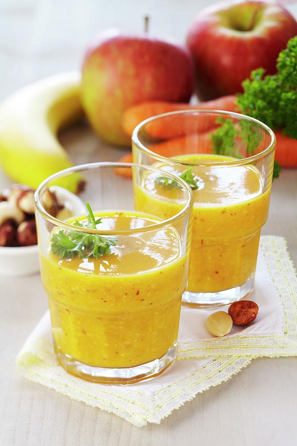 A Smoothie Made From Bananas, Carrots, Apples, Nuts And Raisins Photograph by Franziska Taube