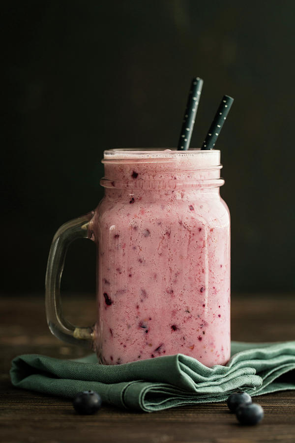 A Smoothie With Almond Milk, Berries And Bananas In A Jar With A Handle Photograph by Valeria Aksakova