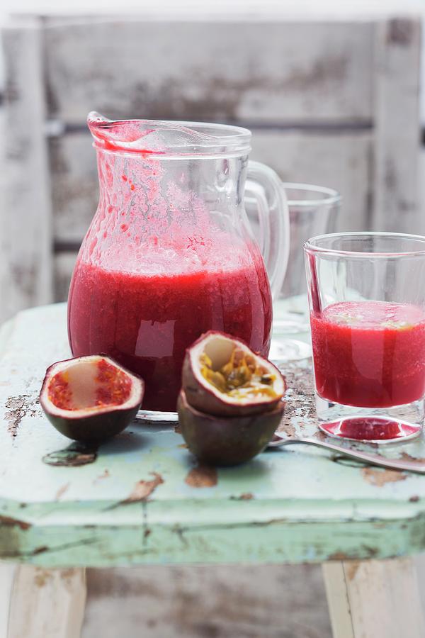 A Smoothie With Raspberries, Passion Fruit And Oranges Photograph by Sandra Eckhardt