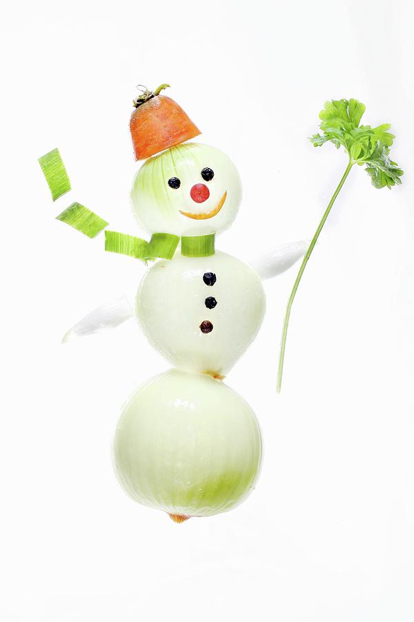 A Snowman Made From Onions, Carrots And Parsley Photograph by Jan Prerovsky