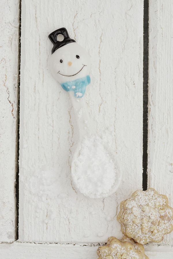 A Snowman Spoon With Powdered Sugar And Cookies Photograph by Martina Schindler