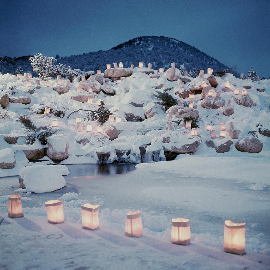 Snowy Garden With Christmas Lanterns Photograph by William Grigsby