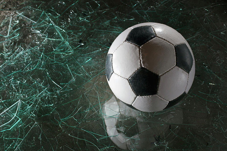A Soccer Ball On Broken Glass Photograph by Dual Dual