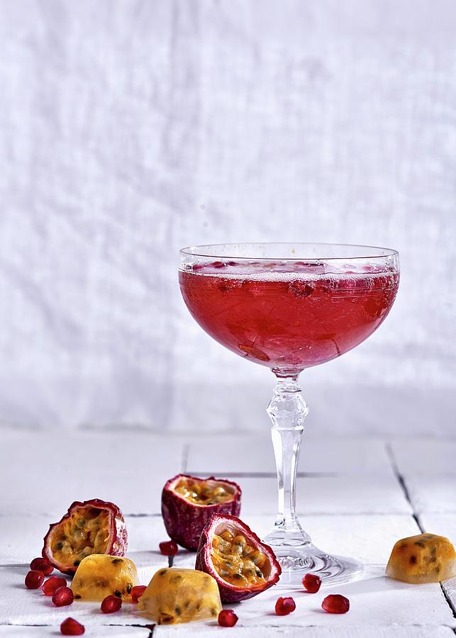 A Sparkling Wine Cocktail With Passion Fruit And Pomegranate Photograph by Great Stock!