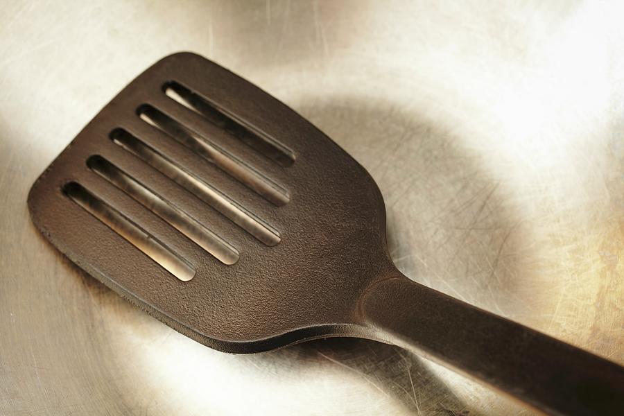 A Spatula In A Stainless Steel Pan Photograph by Brian Yarvin