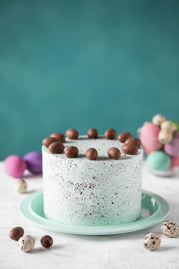 A Speckled Easter Cake Decorated With Chocolate Eggs Photograph by Malgorzata Laniak