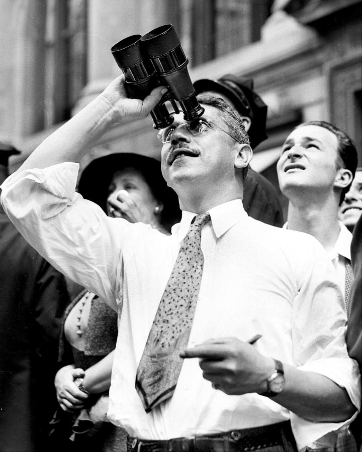 A Spectator Uses Binoculars To Get A Photograph by New York Daily News Archive