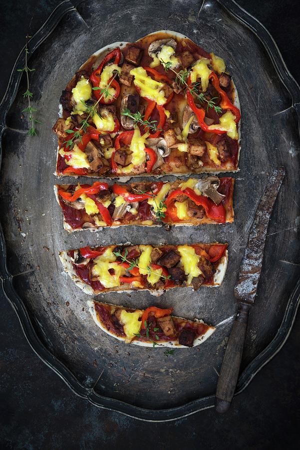 A Spelt And Linseed Pizza Base With Peppers, Mushrooms, Tofu And Vegan Cheese Substitute Photograph by Kati Neudert