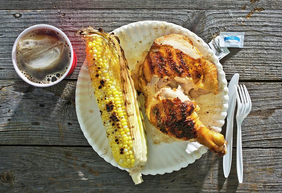 A Spicy Grilled Chicken Leg Served With Corn On The Cob Photograph by Jim Scherer