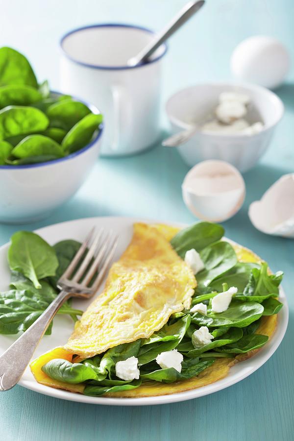 A Spinach And Goats Cheese Omelette With Ingredients Photograph by Olga Miltsova