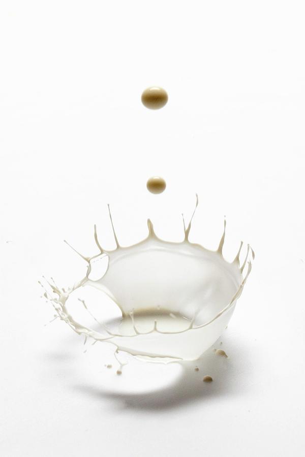 A Splash Of Milk On White Background Photograph by Andr Ainsworth