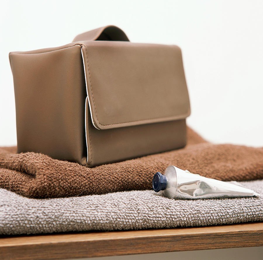 Furniture Photograph - A Sponge Bag On Towels by Luc Wauman