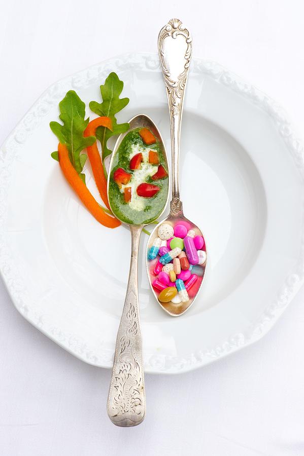 A Spoonful Of Herb Sauce With Peppers And A Spoonful Of Vitamin Pills Photograph by Braas, Nele