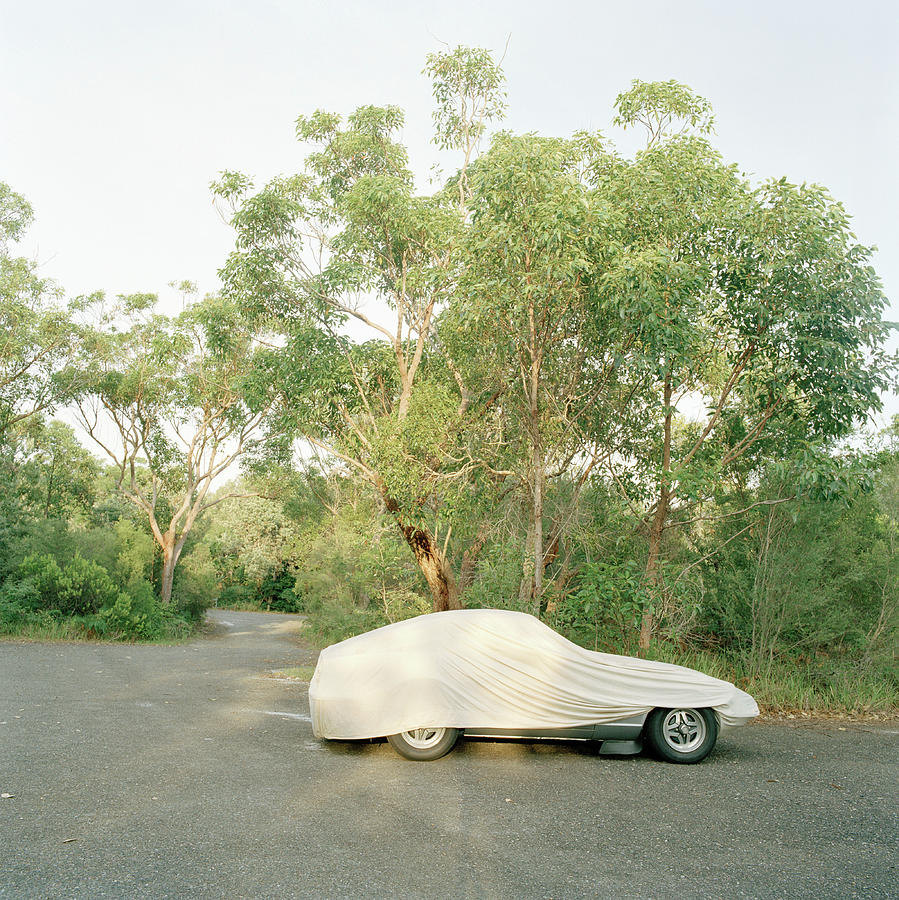A Sports Car Covered With A Tarp Photograph by Julia Christe