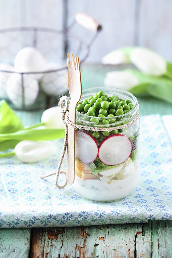 A Spring Salad In A Glass Jar With Peas, Radishes And Egg Photograph by Zita Csig