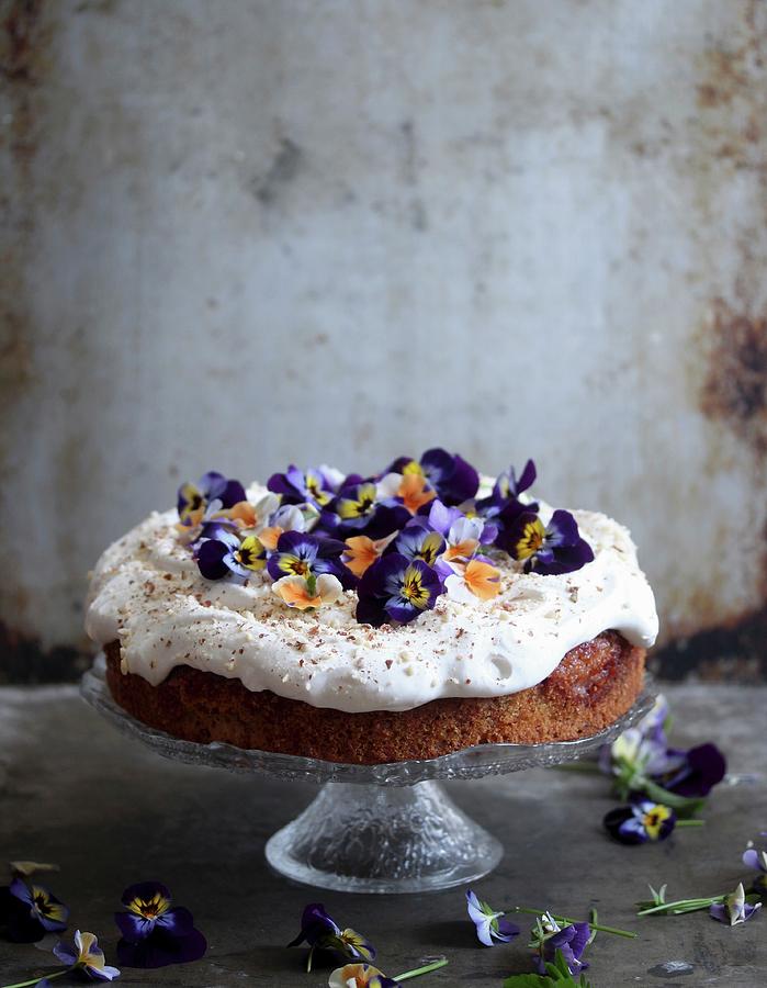 A Springtime Cake Topped With Cream And Pansies Photograph by Milly Kay