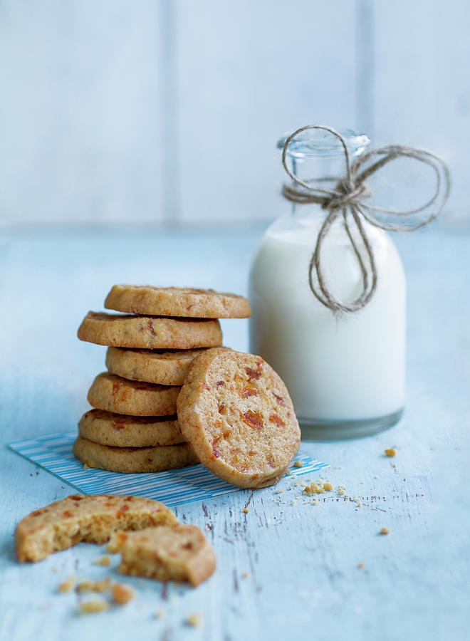 A Stack Of Apricot Biscuits Next To A Milk Bottle Photograph by Eising Studio