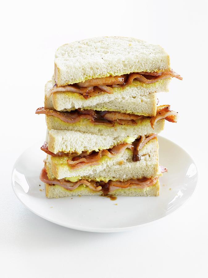 A Stack Of Bacon And Onion Sandwiches Photograph by Bill Kingston