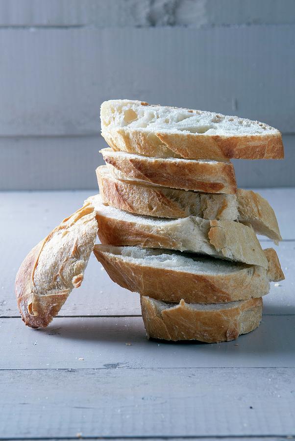 A Stack Of Baguette Slices Photograph by Spyros Bourboulis
