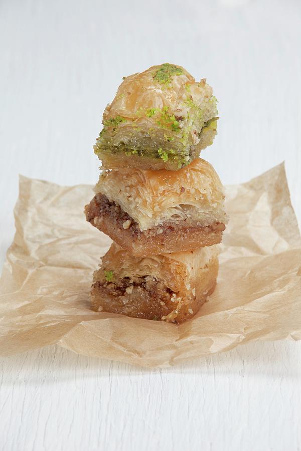 A Stack Of Baklava On Parchment Paper Photograph by Richard Church