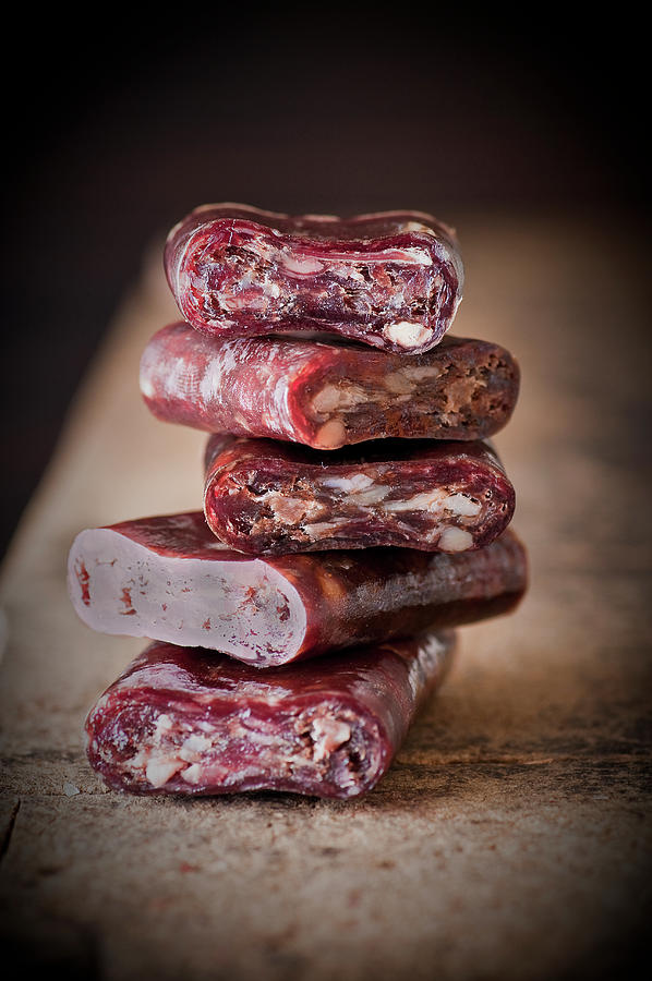 A Stack Of Beef Salami Chunks Photograph by Tomasz Jakusz