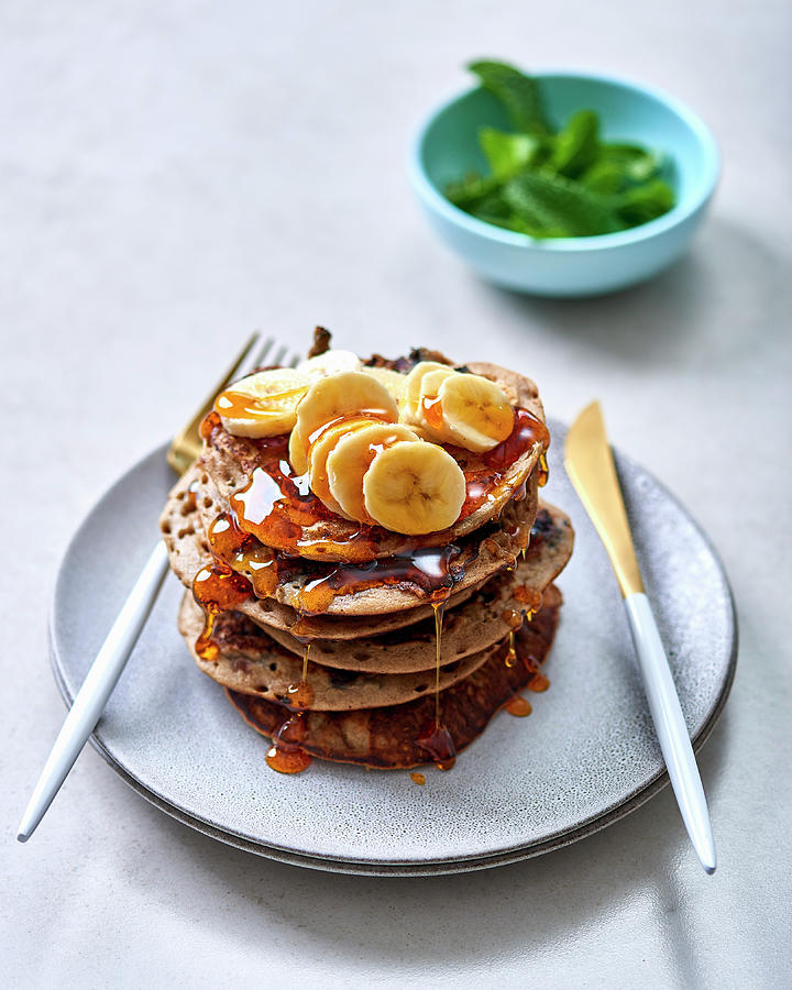 A Stack Of Buckwheat Pancakes With Blueberries, Bananas And Syrup Photograph by Great Stock!